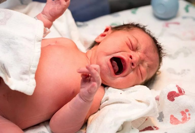 healthy newborn baby after first cry and birth
